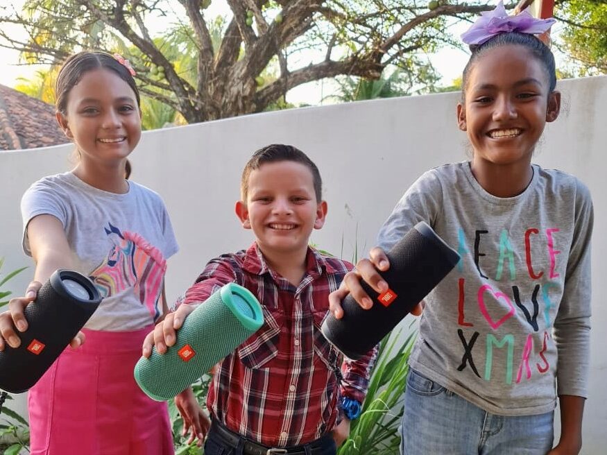 Children holding their brand-new gadgets