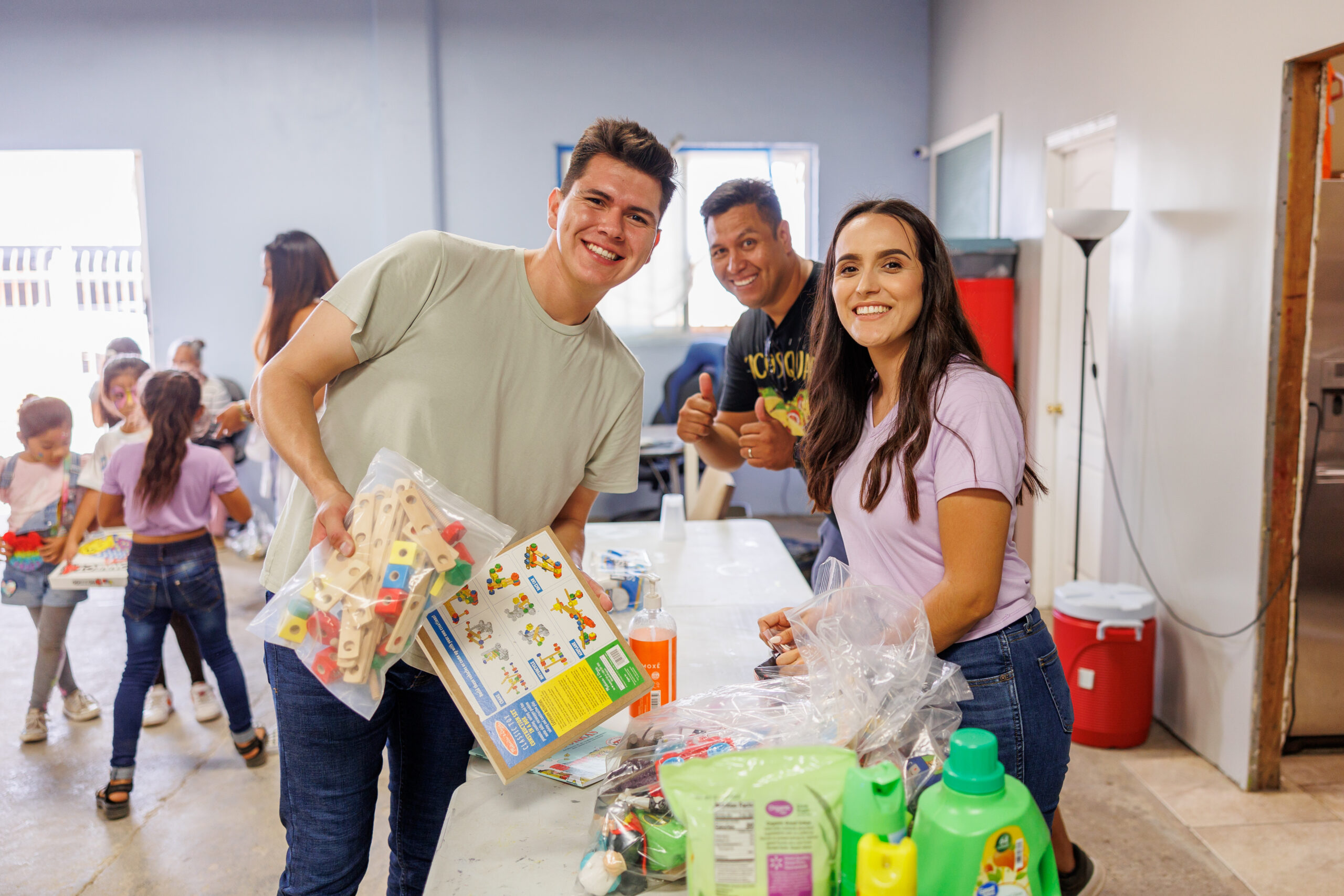San Diego charity Unity 4 Orphans volunteers with donations for children
