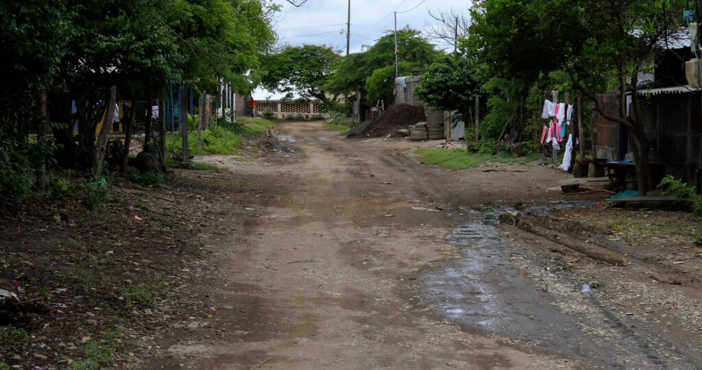 a dirt road in a poor village in Nicaragua