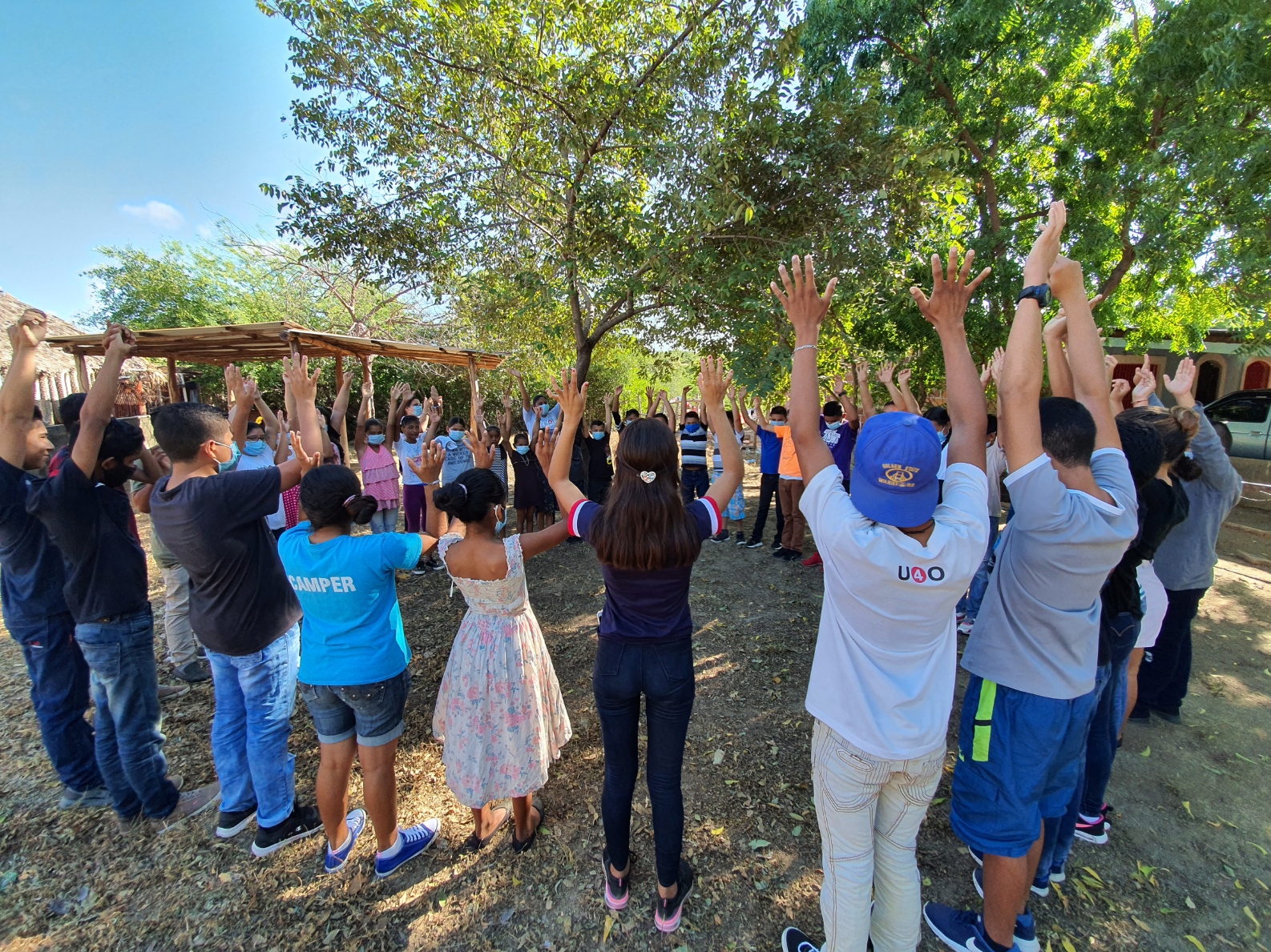 Kids and San Diego Charity U4O Volunteers Praying Together in Miramar, Nicaragua