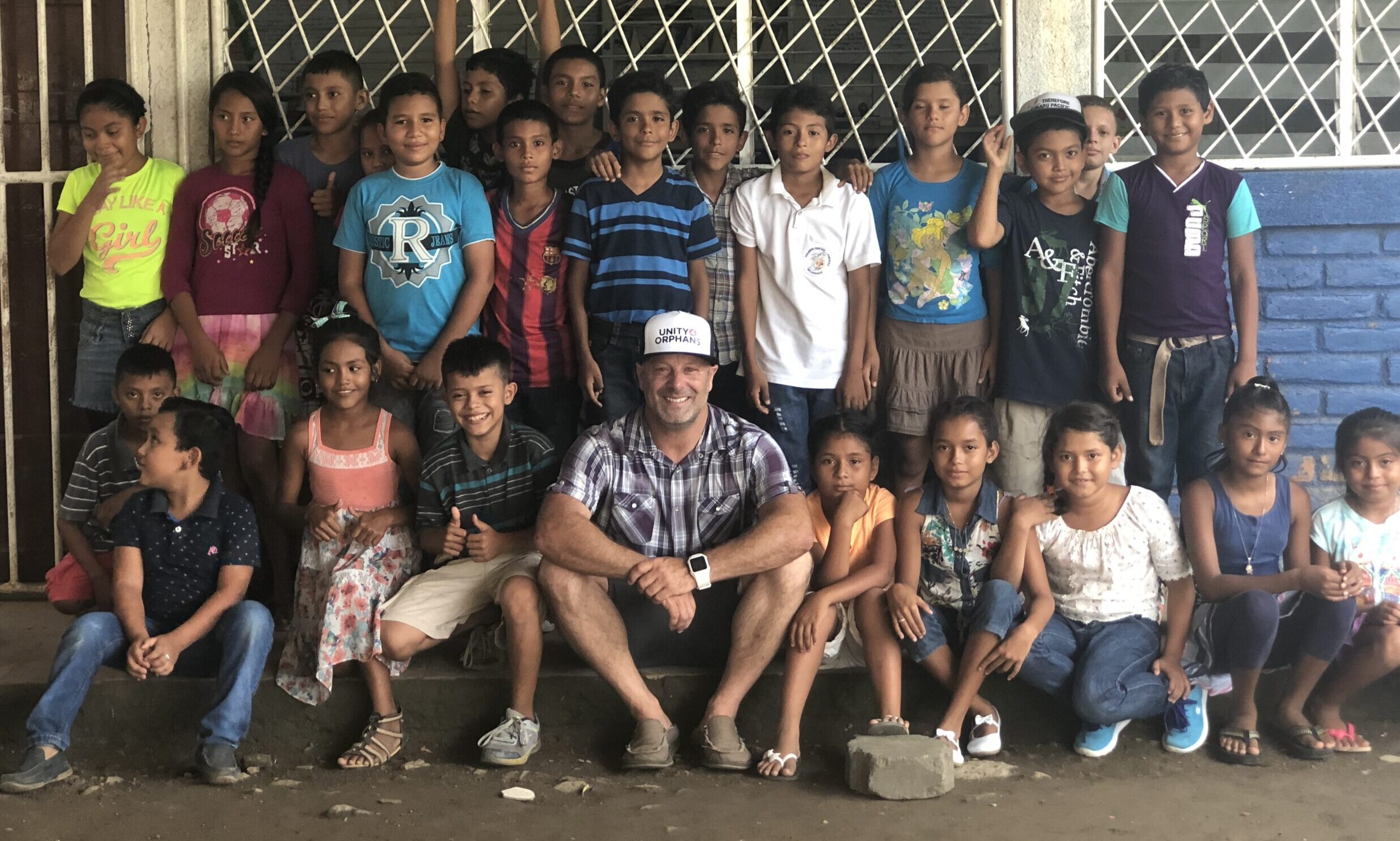 San Diego charity Unity 4 Orphans founder Joe Brandi with children in Nicaragua