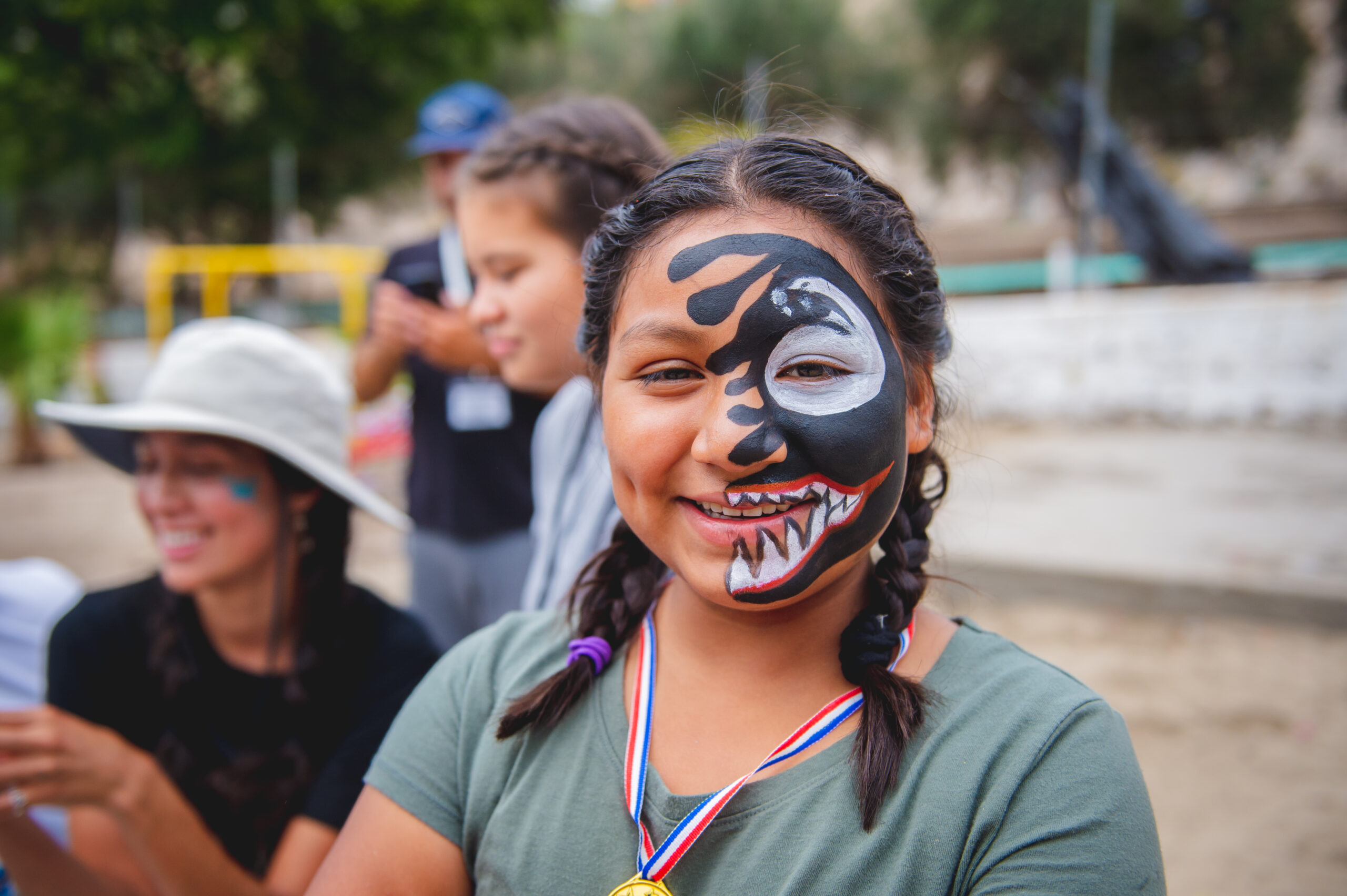 child wearing face paint at an orphanage where Unity 4 Orphans volunteers
