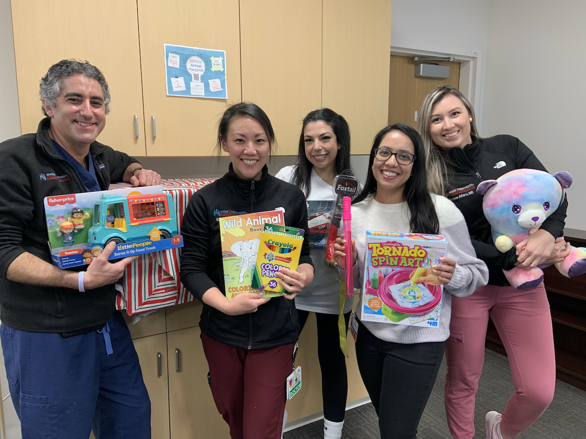 Kaiser Physicians holding the learning materials and art supplies from their collection drive to donate to vulnerable children