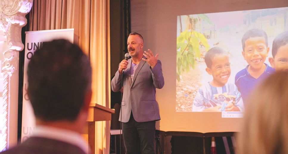 Joe Brandi gives a speech at Unity 4 Orphans' annual Open Hearts Gala fundraiser for children in need