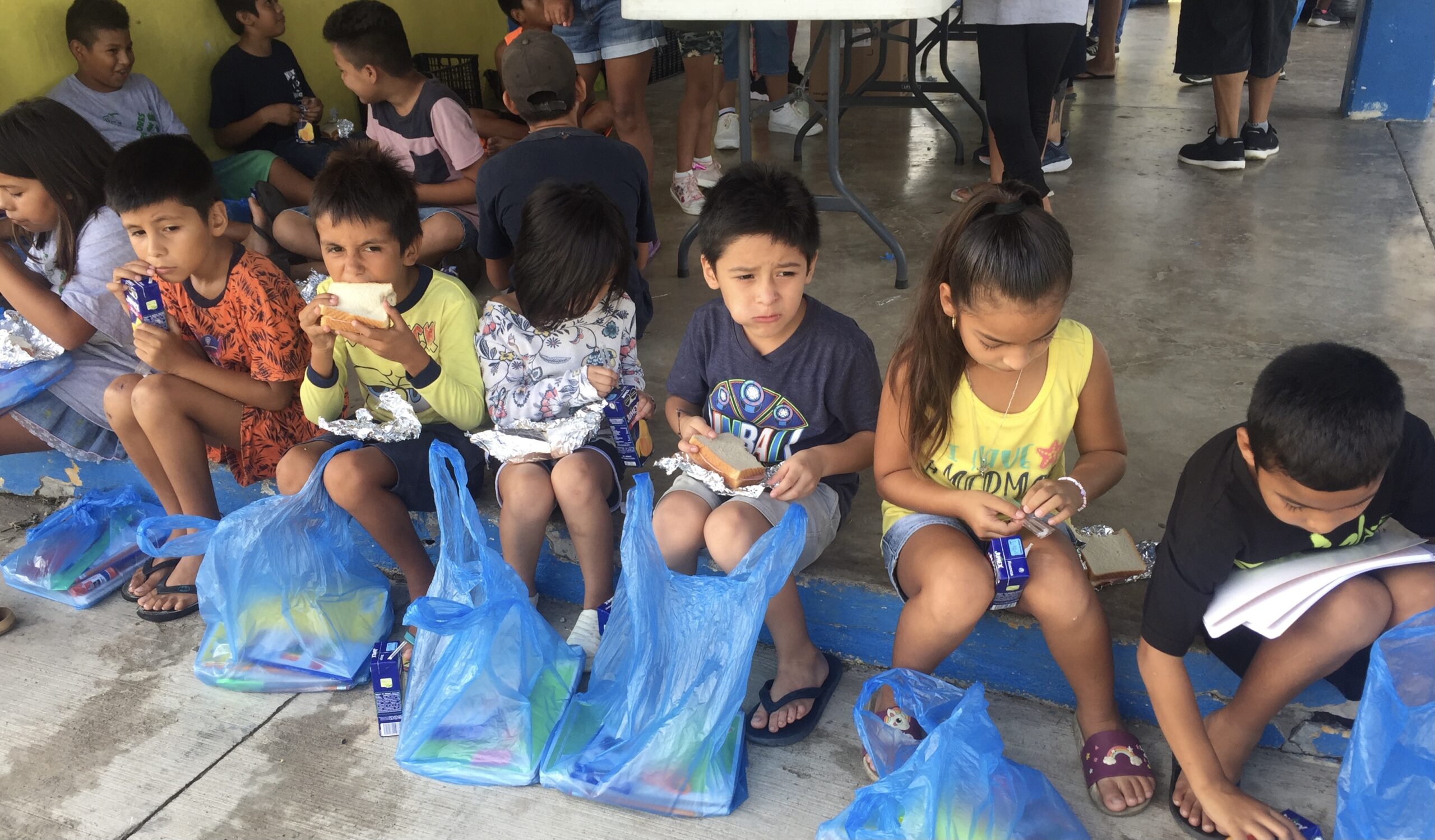 Children with San Diego Charity Unity 4 Orphans' nutrition and ESL program in Punta Mita, Mexico enjoying lunch